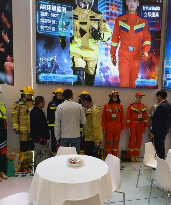 Shanghai Exhibition: Protective clothing on display and conversations at the exhibition booth.