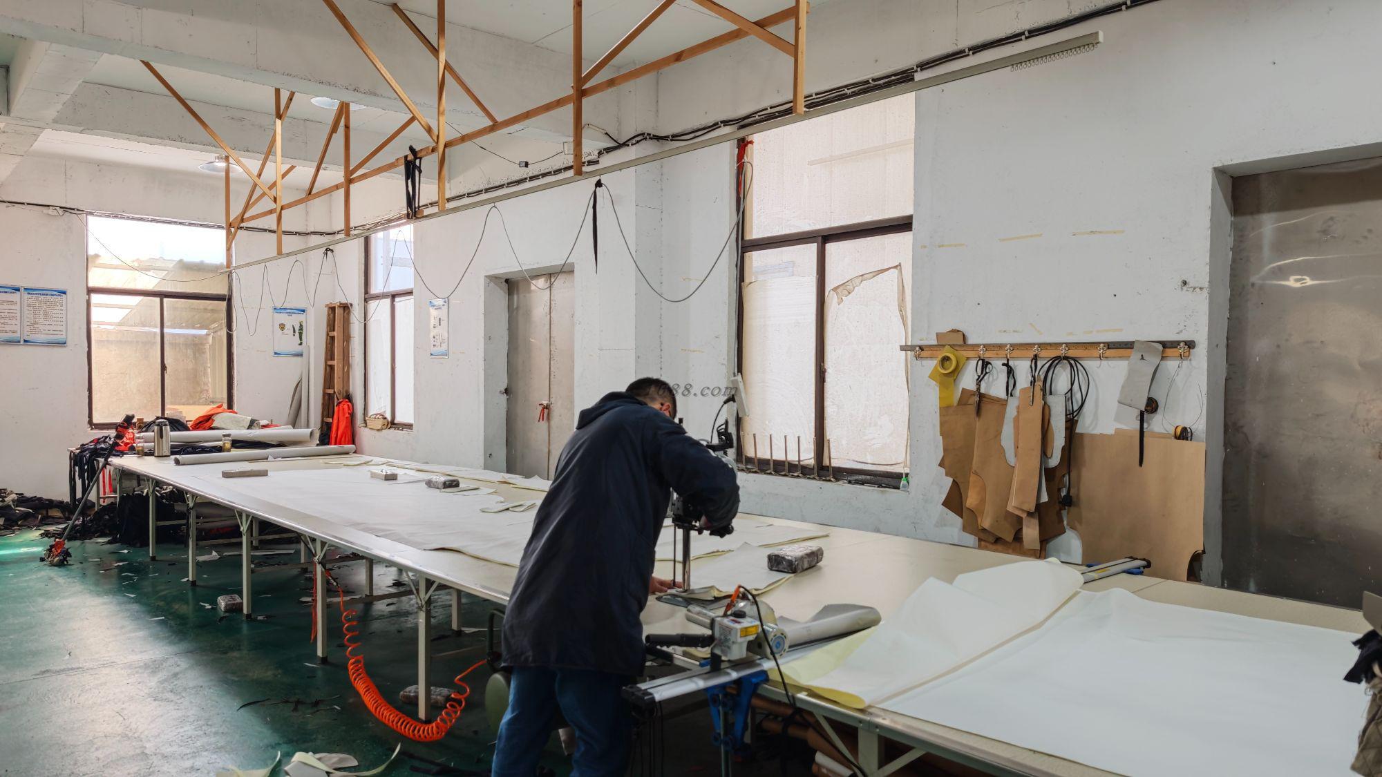 Fabric laid out for cutting and garment preparation.